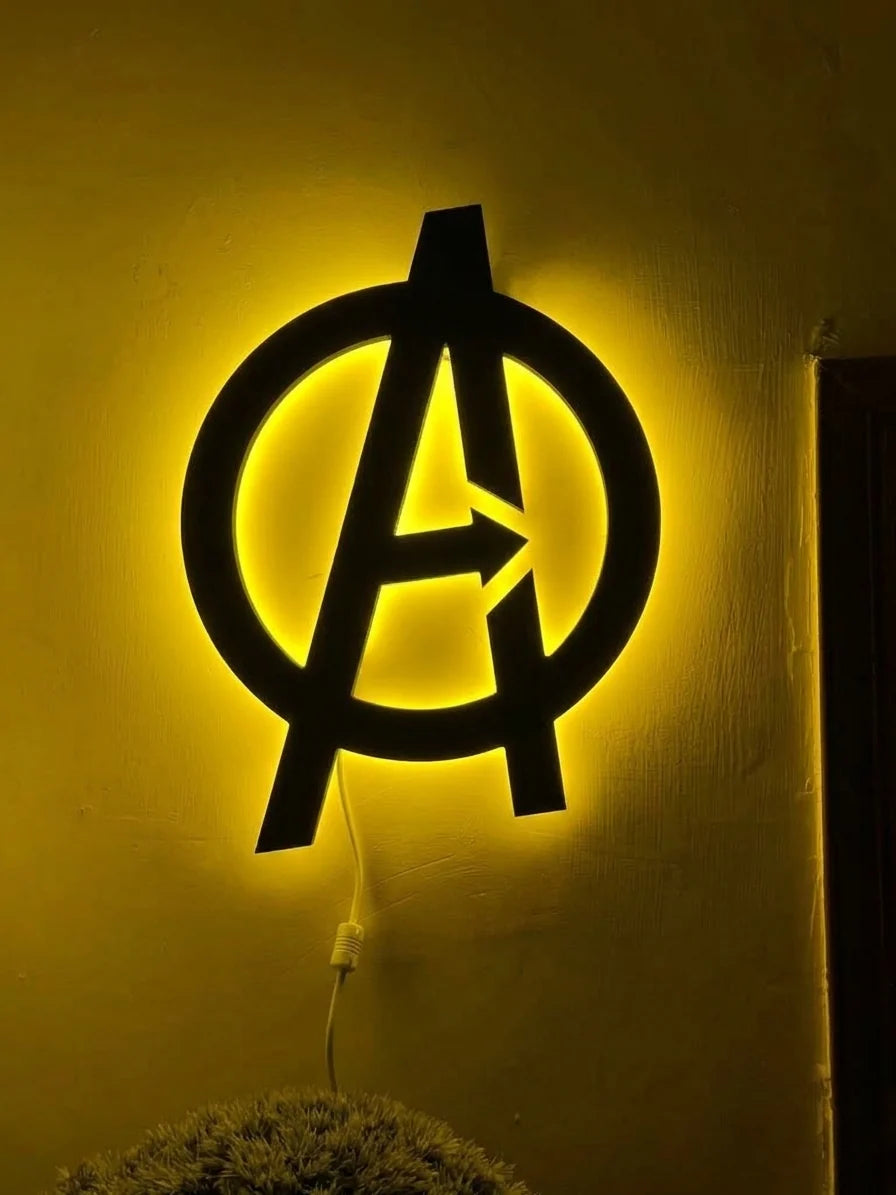 Black Spider Logo LED wall decoration by Evertrend featuring a yellow Avengers logo illuminated for superhero-themed decor.