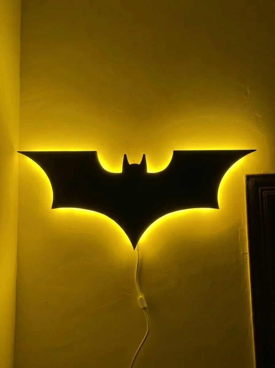 Black Batman logo LED wall decoration featuring a yellow illuminated spider emblem, perfect for Batman-themed room decor.