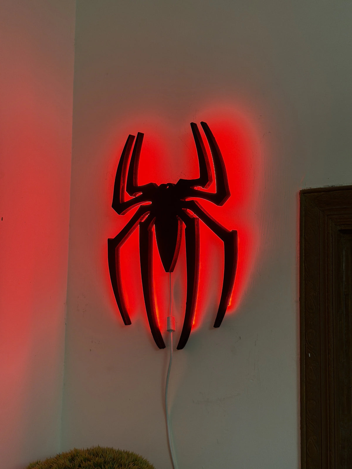 Black Spider Logo LED light wall decoration by Evertrend, featuring a sleek black spider design with illuminated LED lighting.