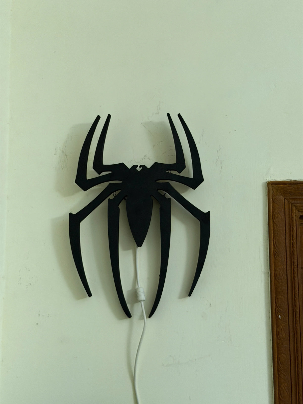 Black Spider Logo LED wall decoration by Evertrend, illuminated black spider logo for wall display, modern and eye-catching design.