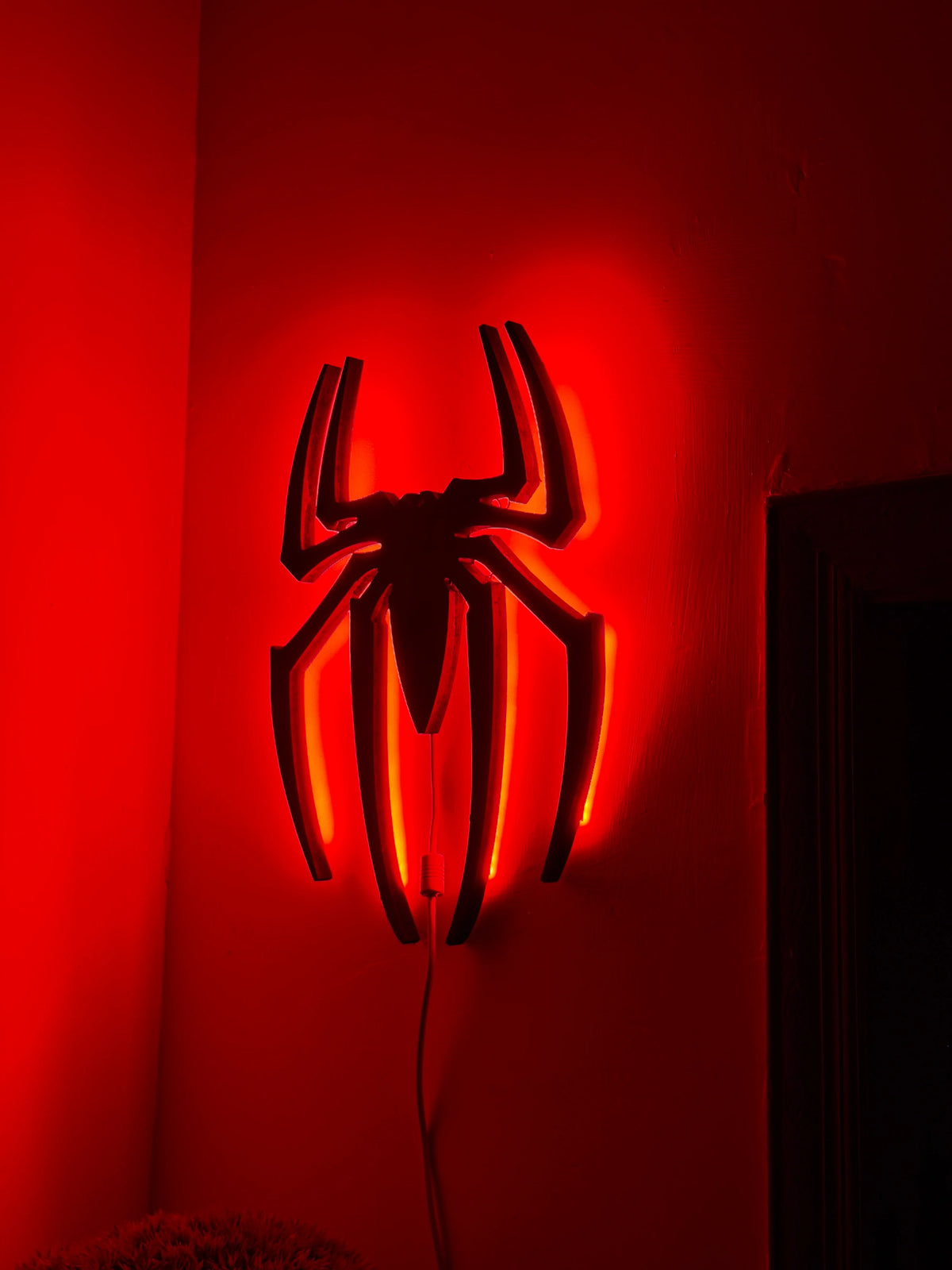 Black Spider Logo LED wall decoration by Evertrend, illuminated black spider design for wall display.