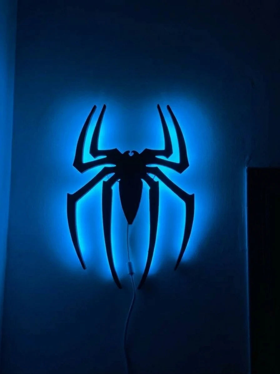 Black spider logo LED wall decoration by Evertrend, illuminated with vibrant blue light, designed for wall display and decor.